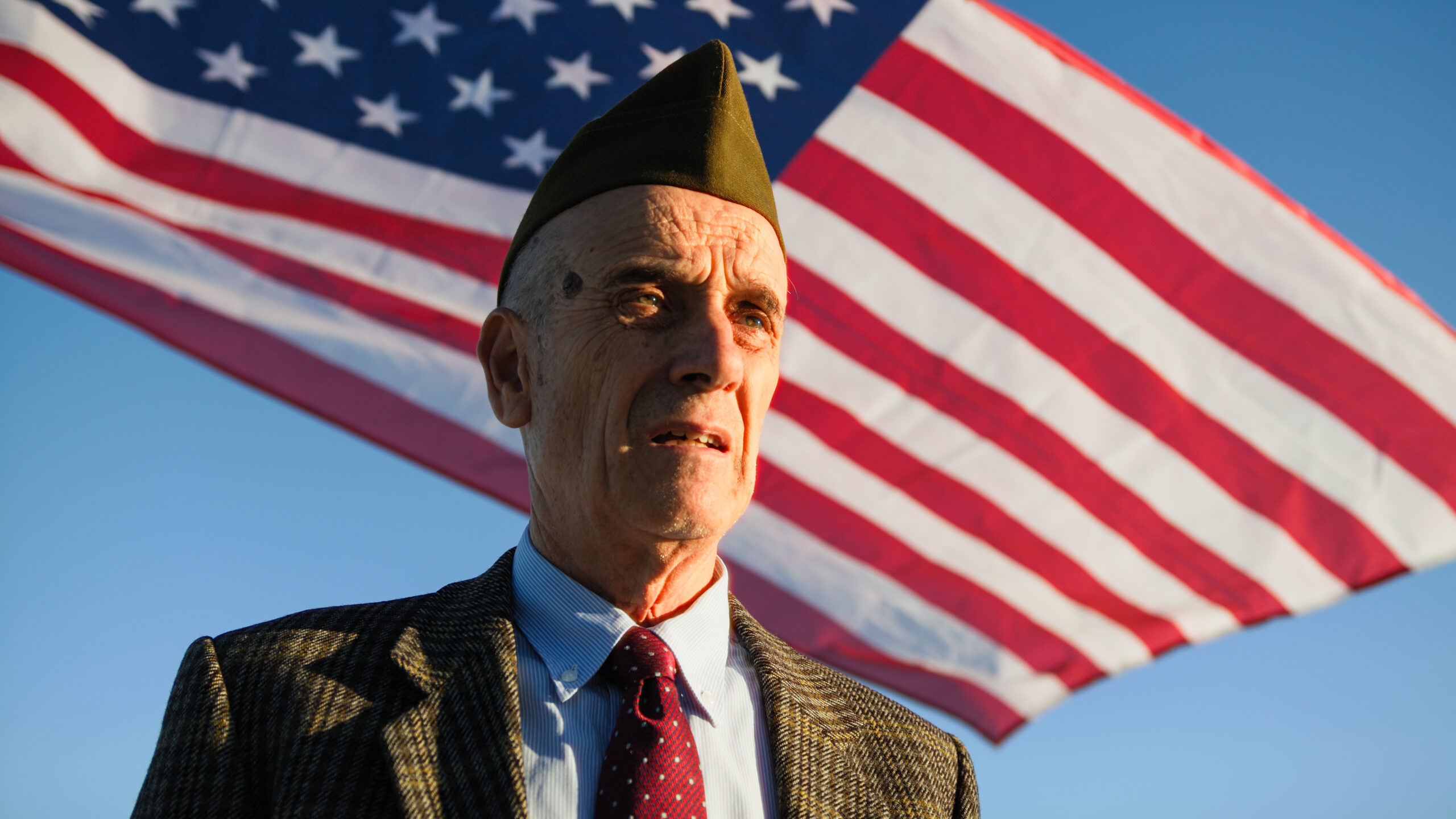 Veteran Makes an Emotional Speech on the Beach Near the Ocean of the Landing.